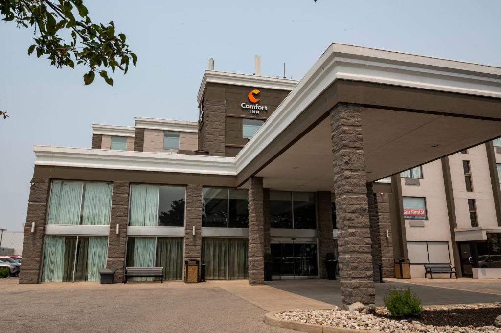 a building with a sign on top of it at Comfort Inn & Conference Centre Toronto Airport in Toronto