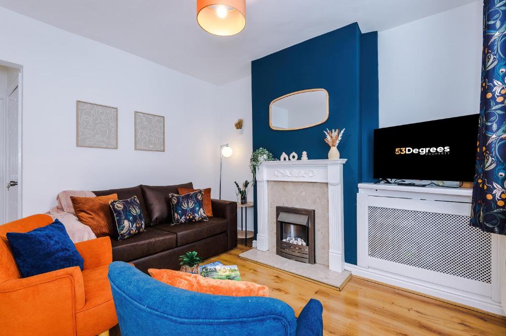 a living room with a couch and a fireplace at NEW! Spacious 2-bed home in Chester City-Centre by 53 Degrees Property, ideal for Couples & Small groups, Great Location - Sleeps 5 in Chester