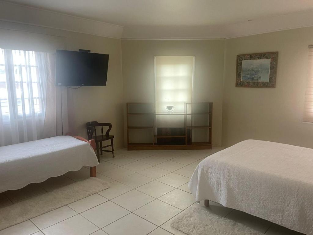Llit o llits en una habitació de Hotel Palermo Quintero