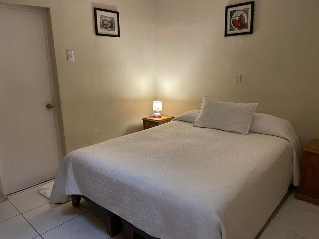 Llit o llits en una habitació de Hotel Palermo Quintero
