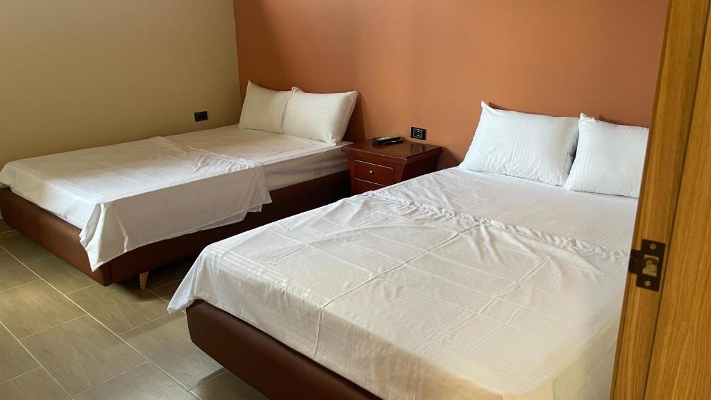 Postel nebo postele na pokoji v ubytování Awa House Hotel