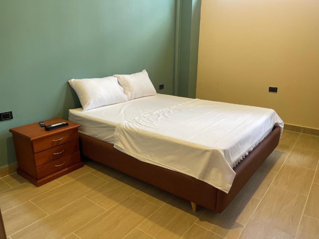 Postel nebo postele na pokoji v ubytování Awa House Hotel