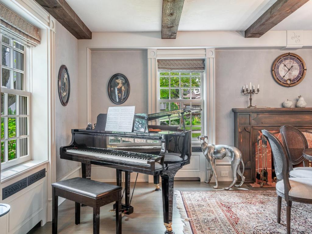 a room with a piano and a dog in it at GLOBALSTAY. Charming 3 Bedroom House in North York in Toronto