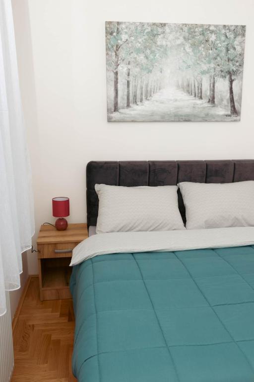 Postel nebo postele na pokoji v ubytování Millennium Apartment