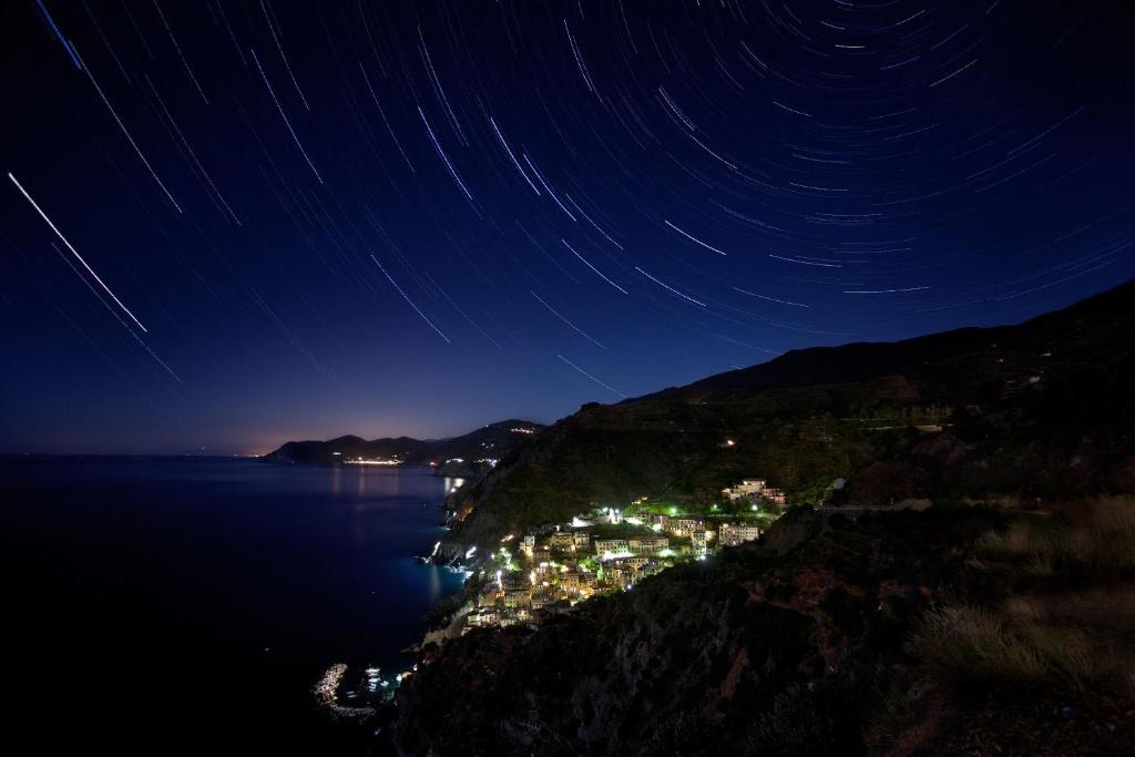 a view of a city at night with stars at Scorci Di Mare in Riomaggiore