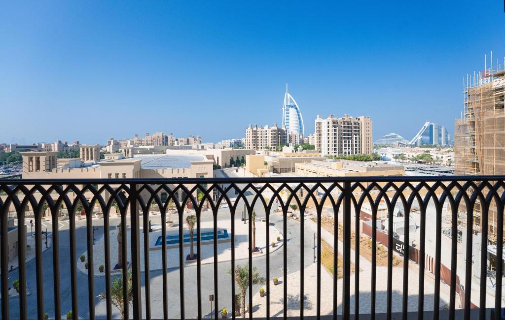 a view of a city from a balcony at 7 Star BurjAlArab Hotel View luxury 2 bdr apt with ammenities in Dubai