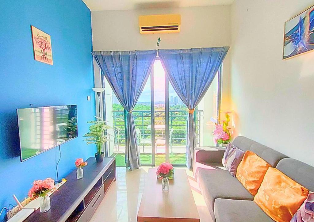 a living room with a couch and a large window at Comfy Park View Stay Above DPulze Mall #DP4 in Cyberjaya