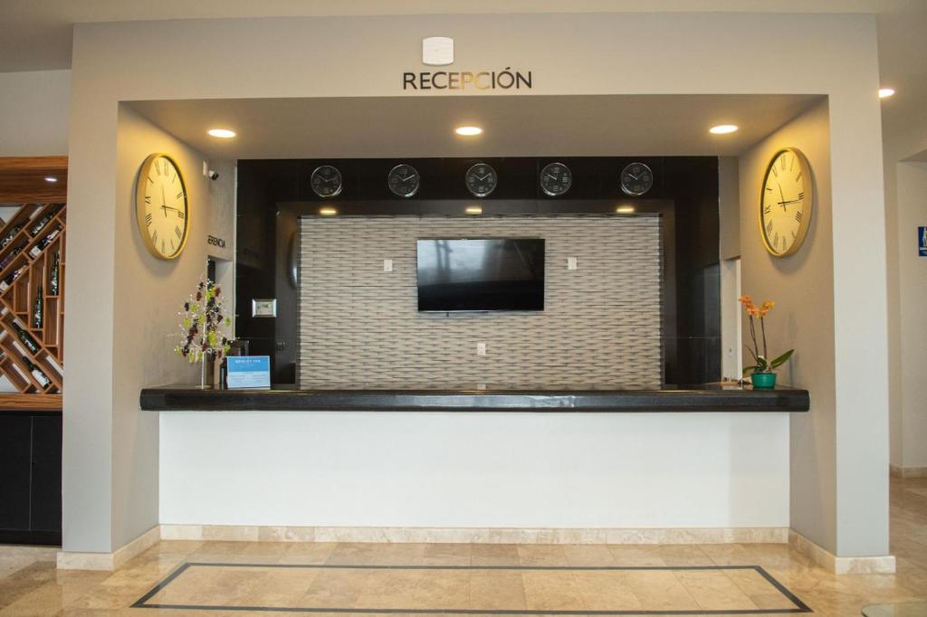 TV a/nebo společenská místnost v ubytování HOTEL MERLOT INN