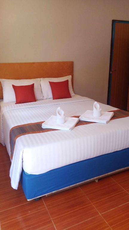 Postel nebo postele na pokoji v ubytování Poonsap Resort
