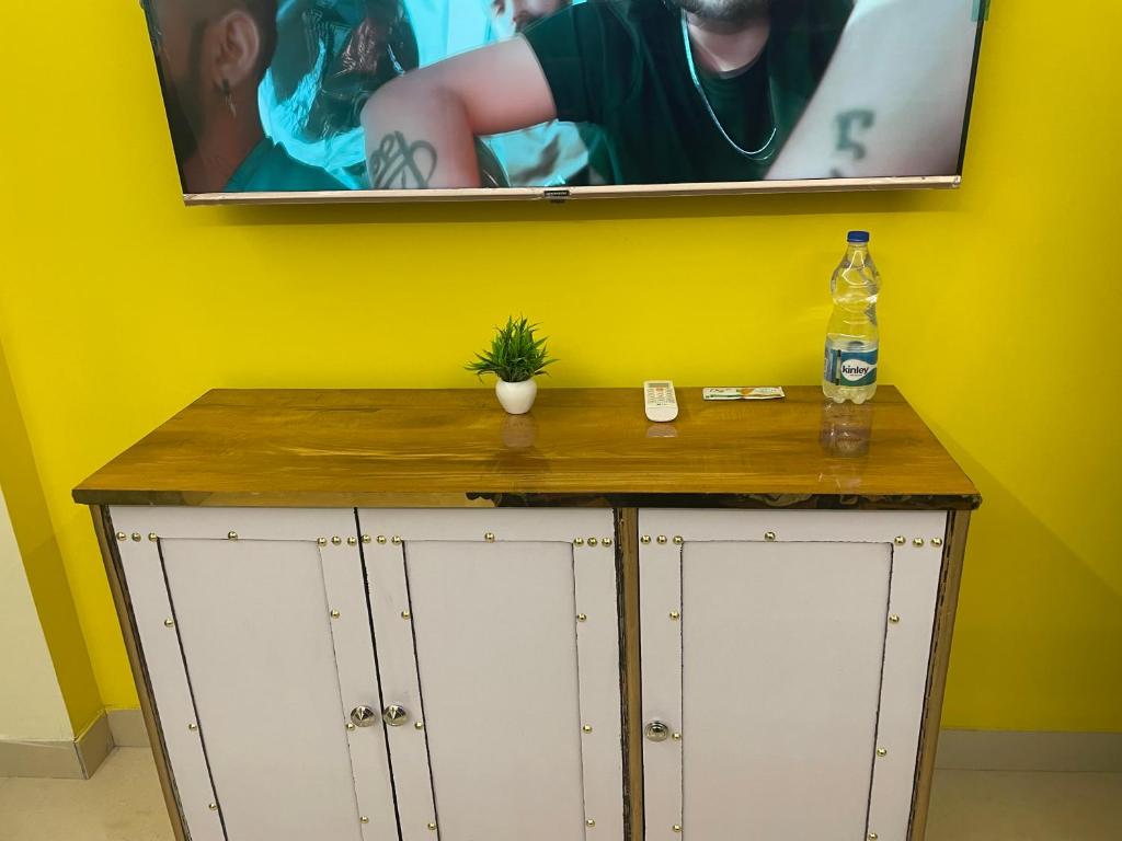 a cabinet with a bottle of water on top of it at Cozzy Inn in Bhauli