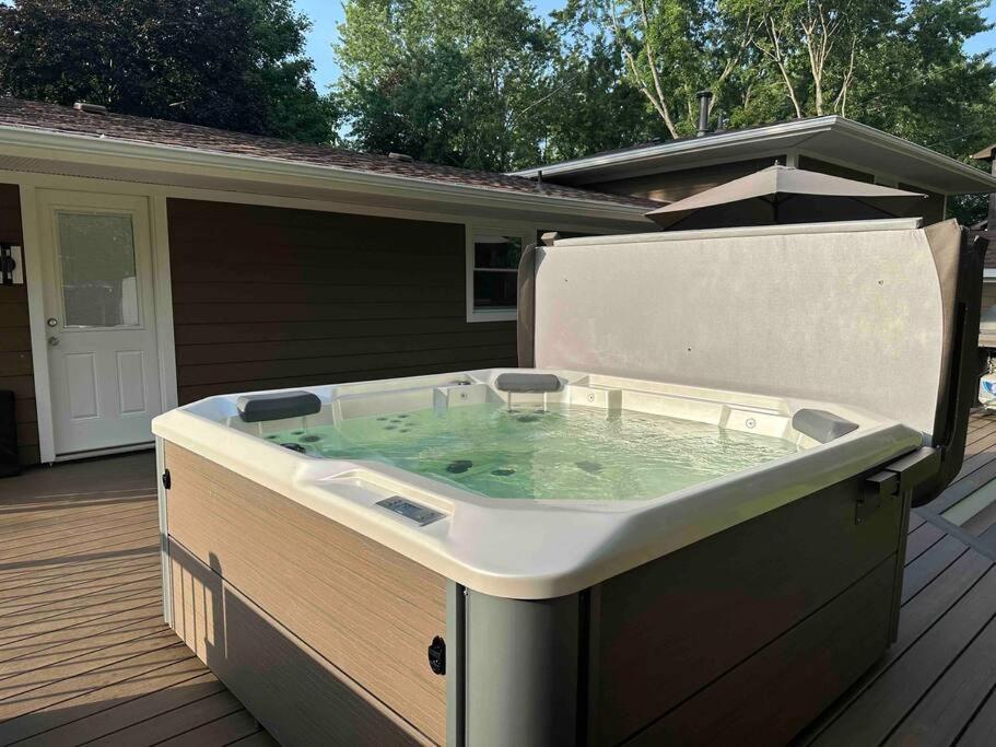 a hot tub on the deck of a house at Hot tube/Large Yard 20min to beach! in LaPorte