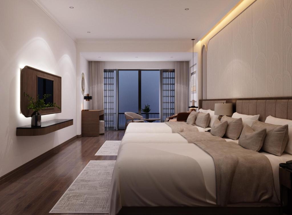 TV a/nebo společenská místnost v ubytování L'amant de Hanoi Hotel - khách sạn Lamant de Hà Nội