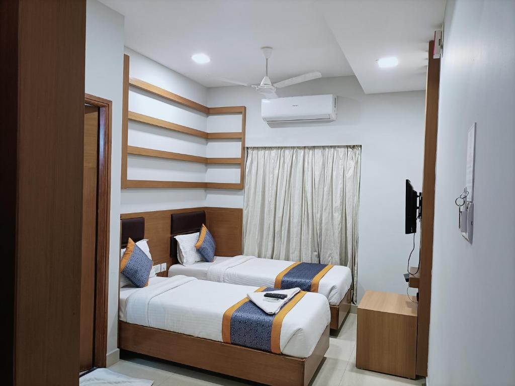 Posteľ alebo postele v izbe v ubytovaní Hotel Zain Grande