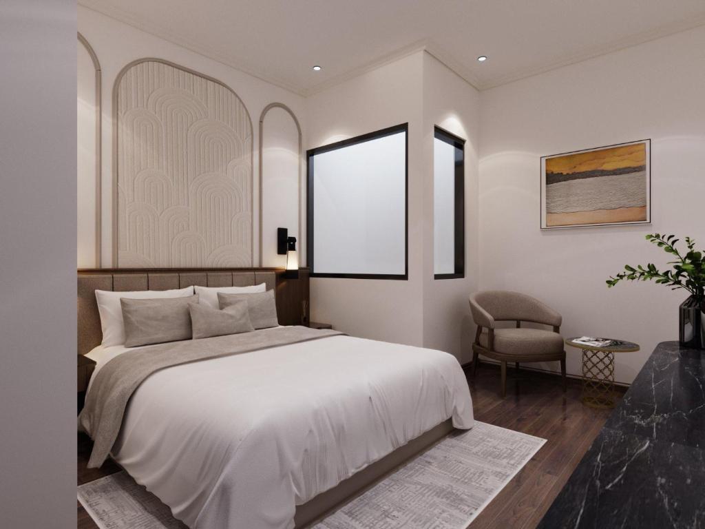 Postel nebo postele na pokoji v ubytování L'amant de Hanoi Hotel - khách sạn Lamant de Hà Nội