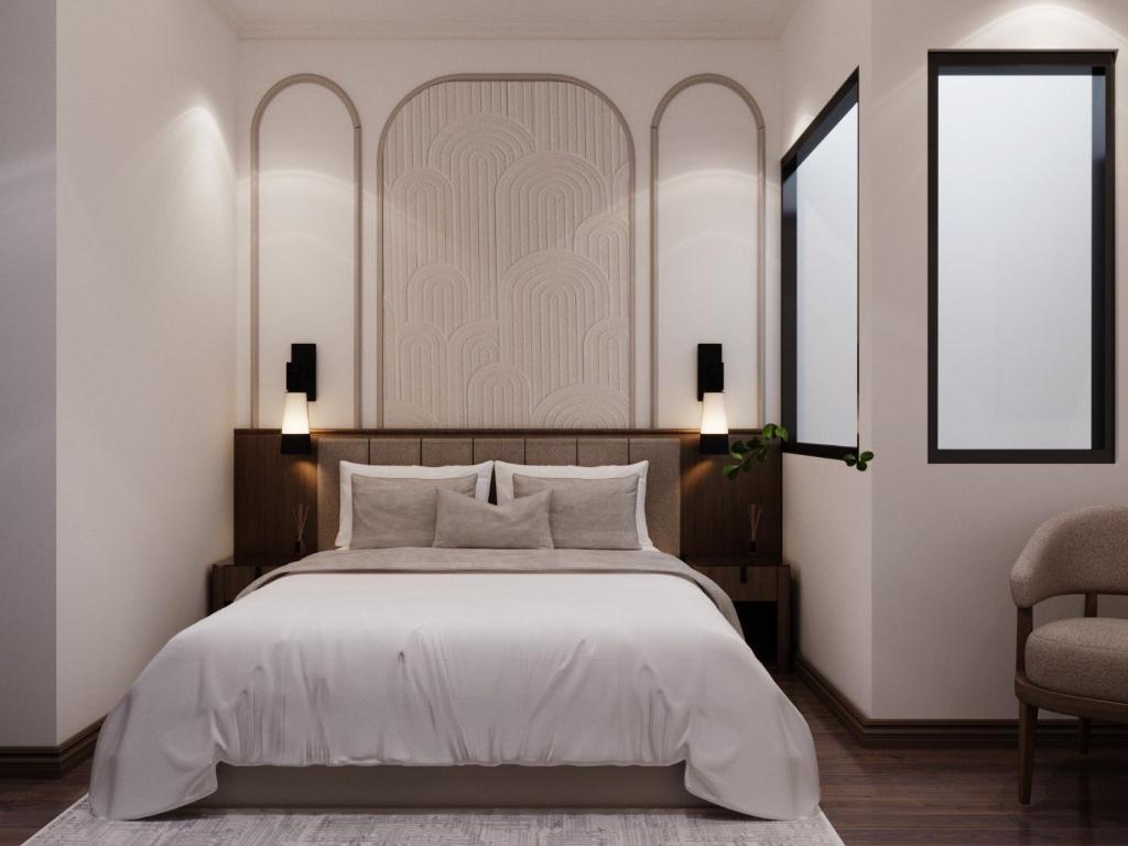 Postel nebo postele na pokoji v ubytování L'amant de Hanoi Hotel - khách sạn Lamant de Hà Nội