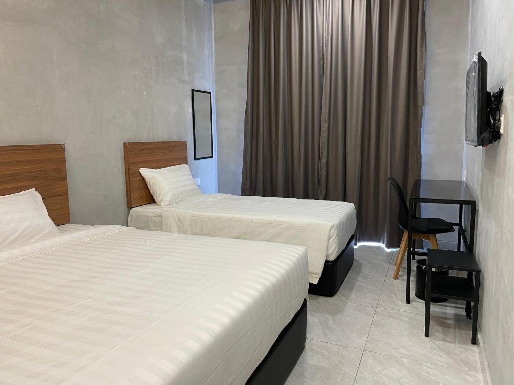 Postel nebo postele na pokoji v ubytování HPY Hotel