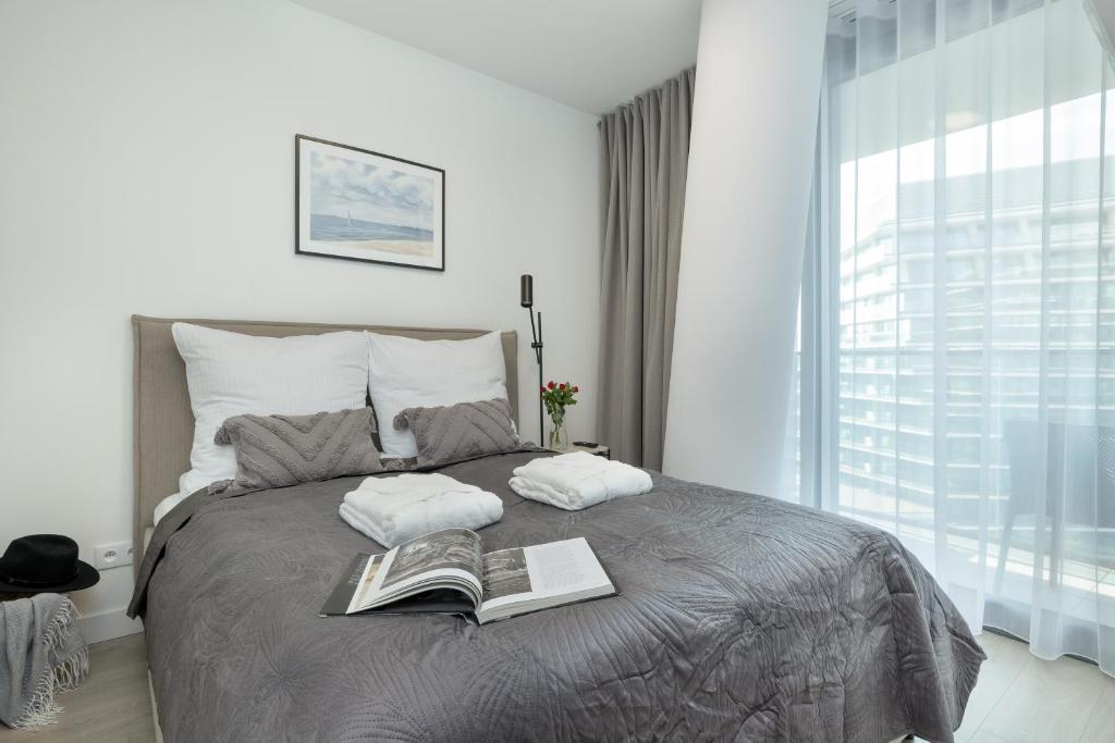 Postel nebo postele na pokoji v ubytování Wave by Baltic Home