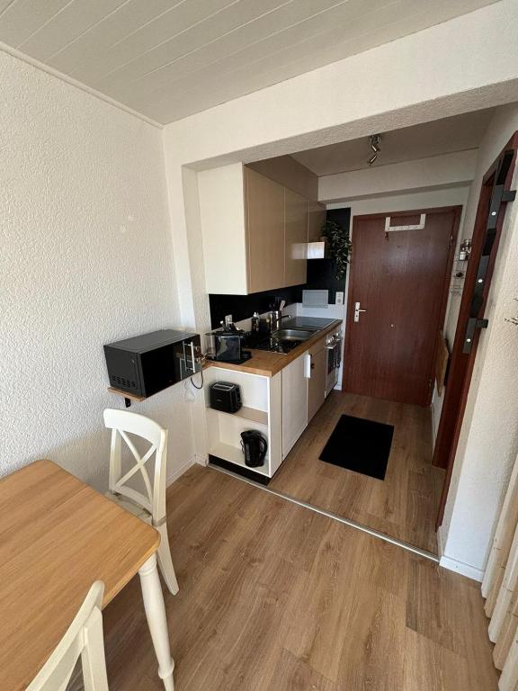 TV a/nebo společenská místnost v ubytování Vue imprenable sur les Alpes et Parking privé gratuit