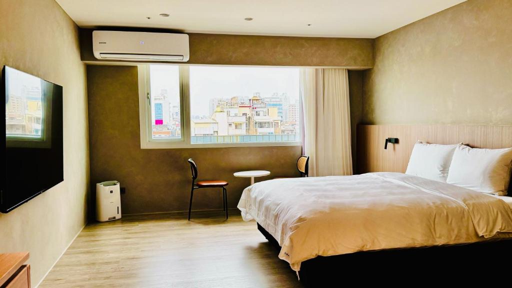 Postel nebo postele na pokoji v ubytování Hope Hotel Tainan