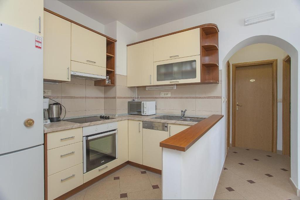 Kuchyň nebo kuchyňský kout v ubytování Apartments Villa Maris