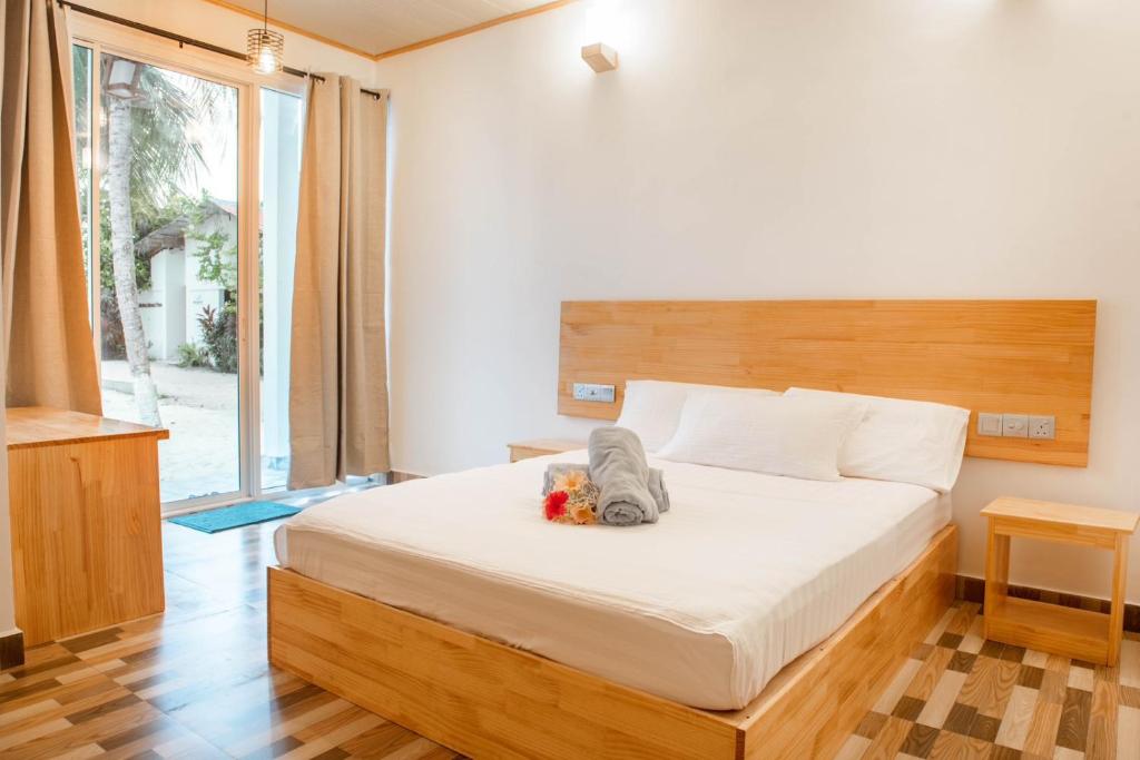 Postel nebo postele na pokoji v ubytování Fulidhoo Hathaa Retreat