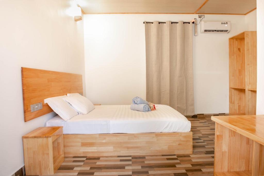 Postel nebo postele na pokoji v ubytování Fulidhoo Hathaa Retreat