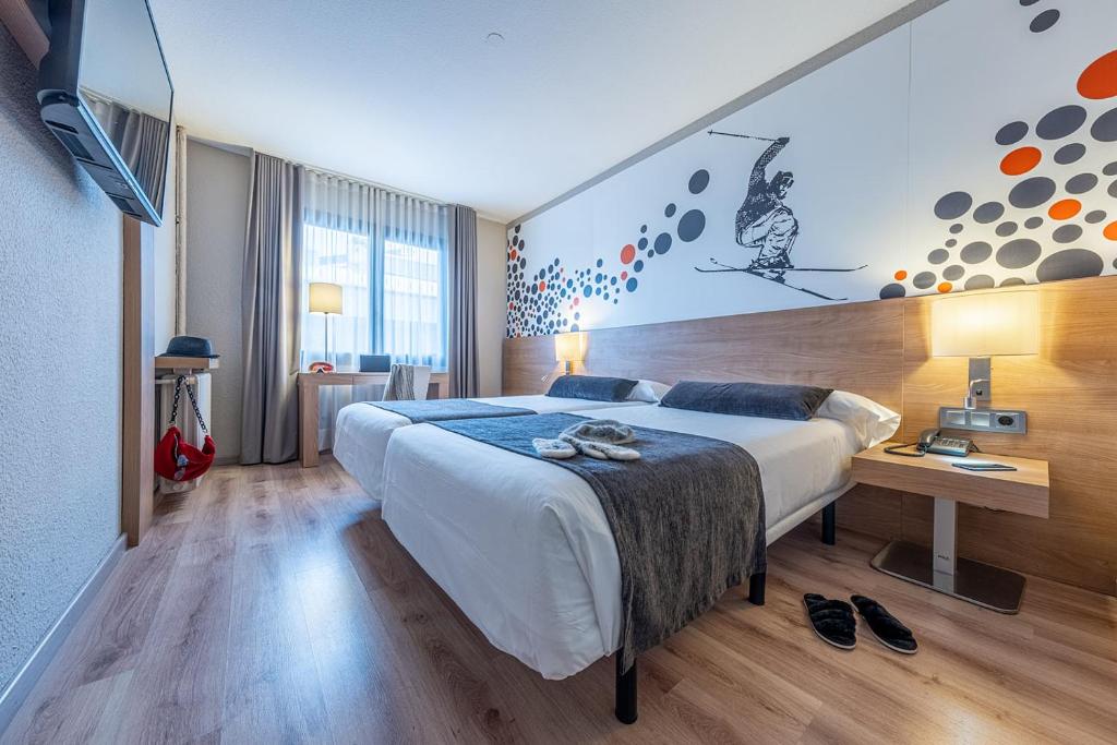 Postel nebo postele na pokoji v ubytování Hotel Sporting