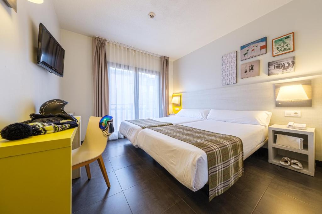 Voodi või voodid majutusasutuse Hotel Cristina toas