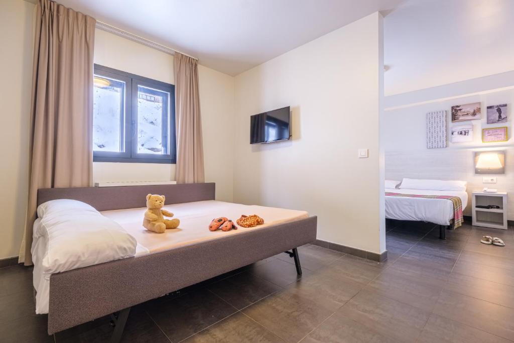Voodi või voodid majutusasutuse Hotel Cristina toas