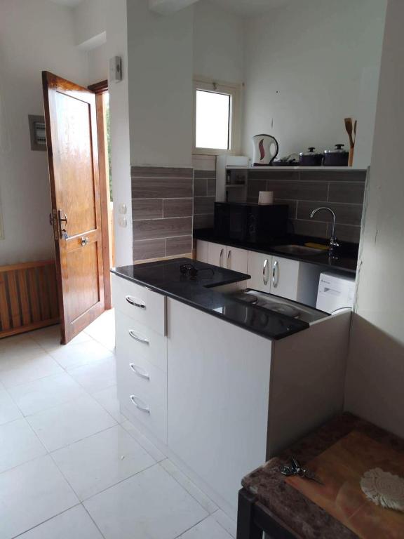 a kitchen with a sink and a counter top at g. ground floor with garden in Hurghada