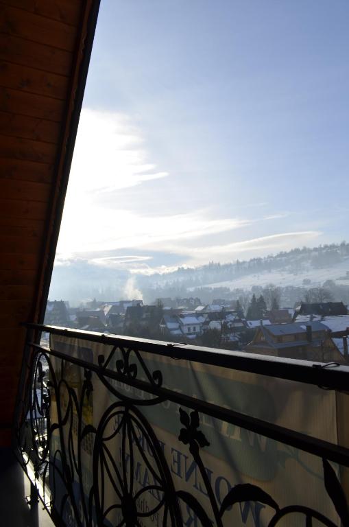a view of a city from a balcony at Willa Pod Lasem in Biały Dunajec