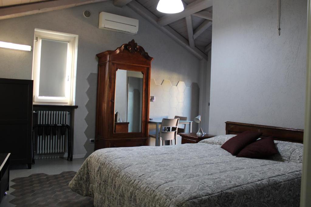 Postel nebo postele na pokoji v ubytování Red Wine Camere