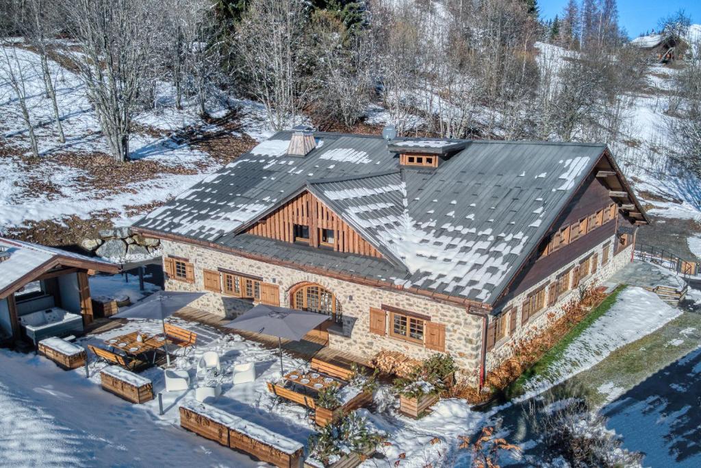 an aerial view of a house in the snow at La Collection - Le Chalet Remy in Saint-Gervais-les-Bains