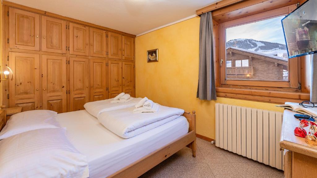 Кровать или кровати в номере Chalet Li Mina