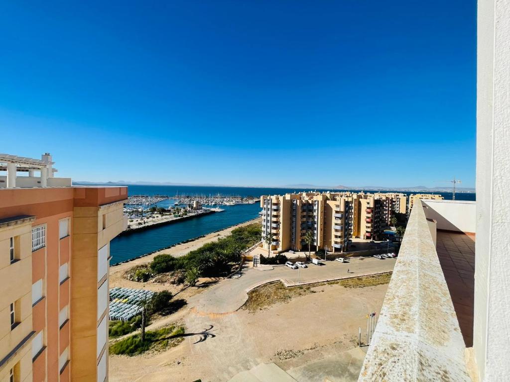a view of the ocean from the balcony of a building at Puerto Mar Fase I - Atico in La Manga del Mar Menor