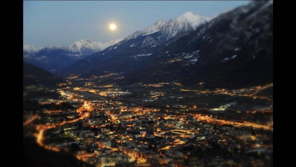 a view of a city with mountains in the background at La stanza dei segreti in Aosta