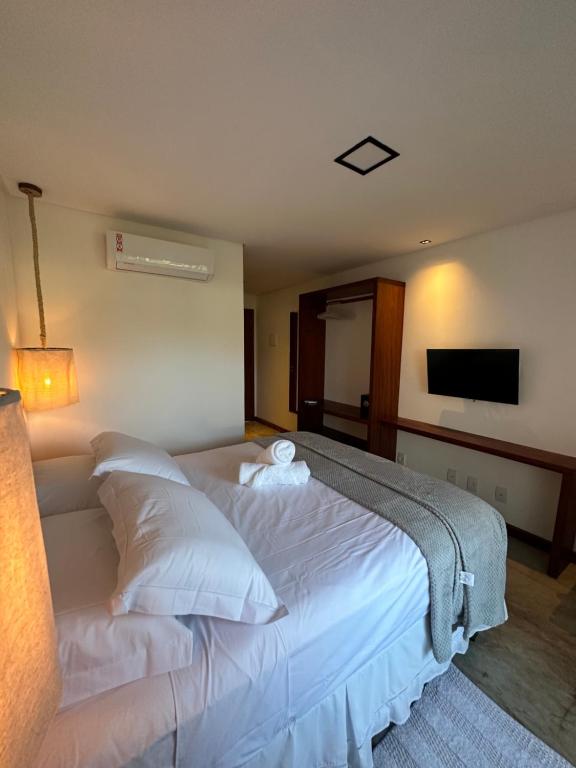 Letto o letti in una camera di Joju Bangalôs & Bistrô
