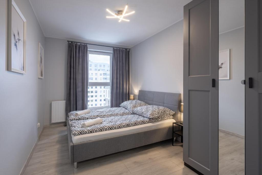 Postel nebo postele na pokoji v ubytování 03 Gdynia Premium - Apartament Mieszkanie dla 4os