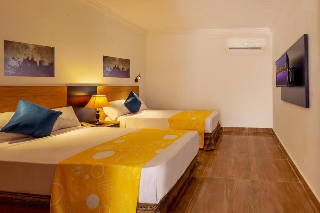 Postel nebo postele na pokoji v ubytování Seti Sharm Palm Beach Resort Families and couples only