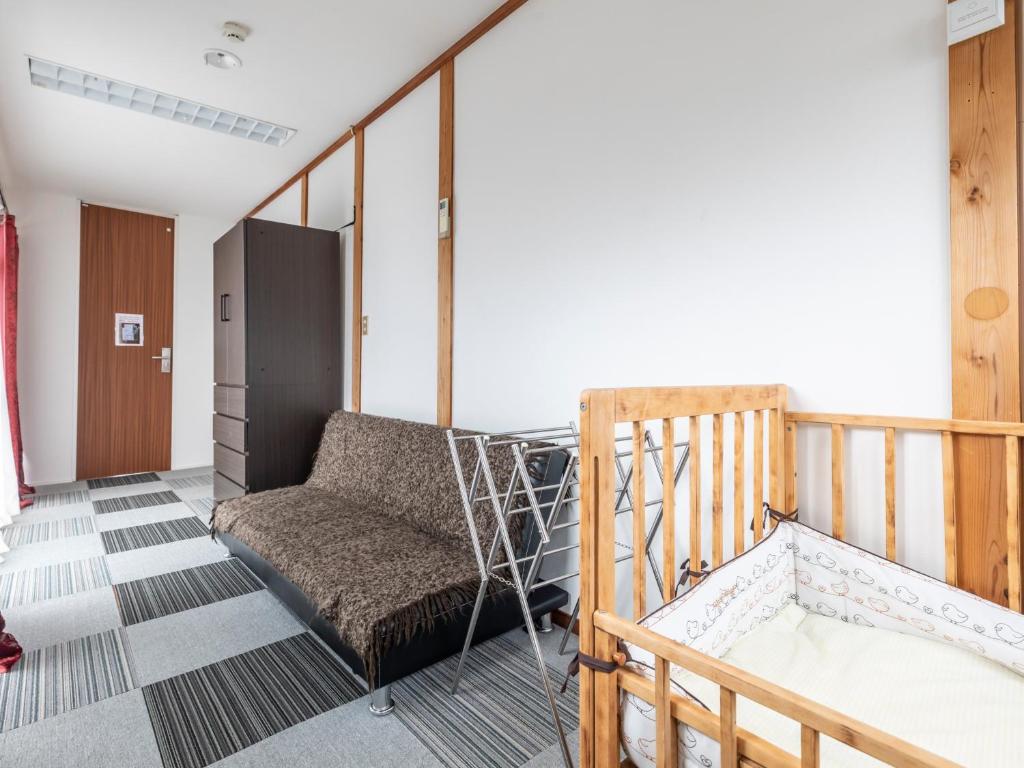Postel nebo postele na pokoji v ubytování Tabist International Hotel Kaike