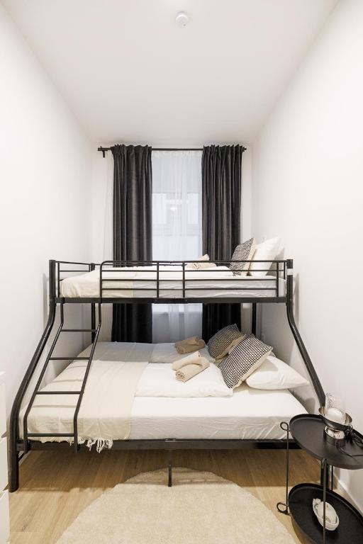 Postel nebo postele na pokoji v ubytování Central City Style Rooms by Home2