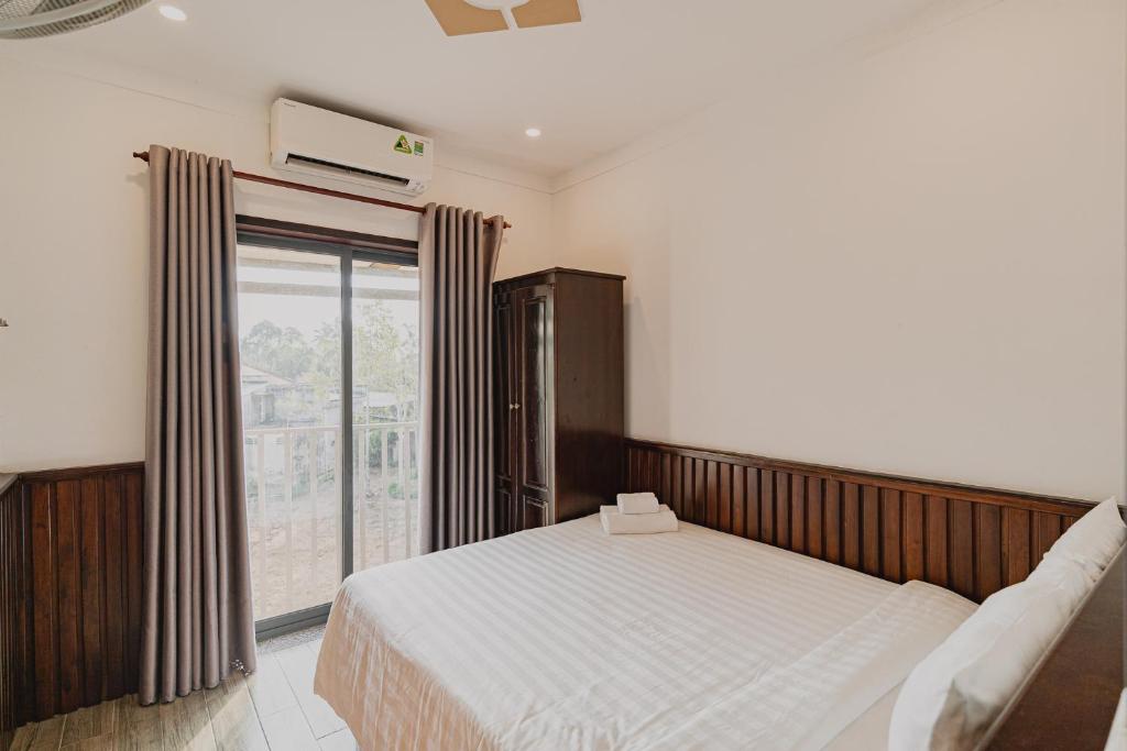 Giường trong phòng chung tại Valentina Resort & Spa Phu Quoc