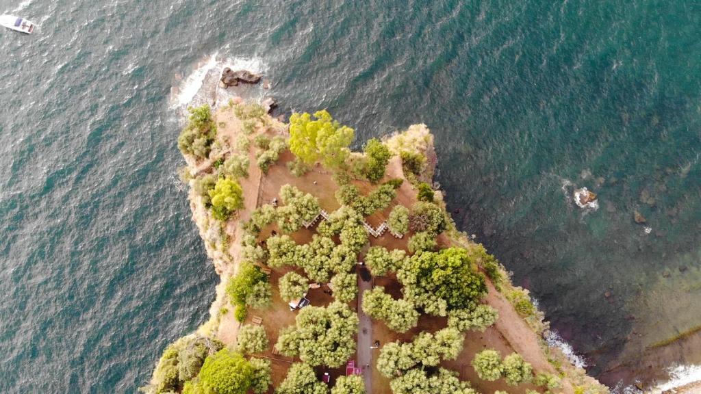 an aerial view of an island in the ocean at Sopramare Resort in Piano di Sorrento