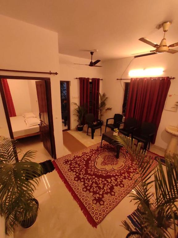 A bed or beds in a room at SAND BEACH HOUSE VARKALA