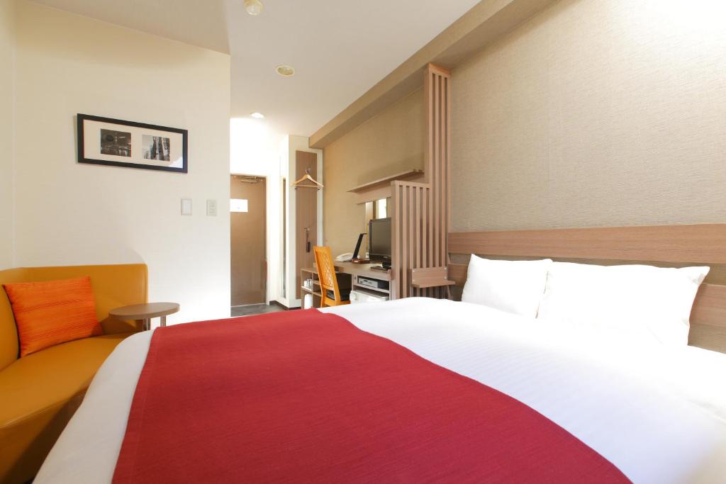 Postel nebo postele na pokoji v ubytování HOTEL MYSTAYS Kameido