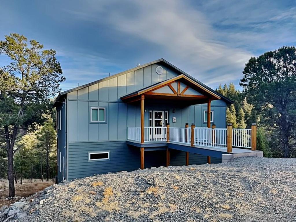 a blue house on top of a pile of gravel at Crown Jewel in Ruidoso
