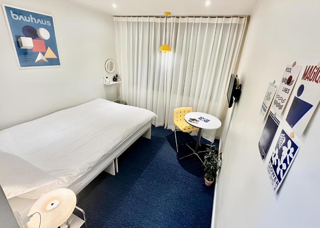 Postel nebo postele na pokoji v ubytování SSH Ikseon peter cat Hostel
