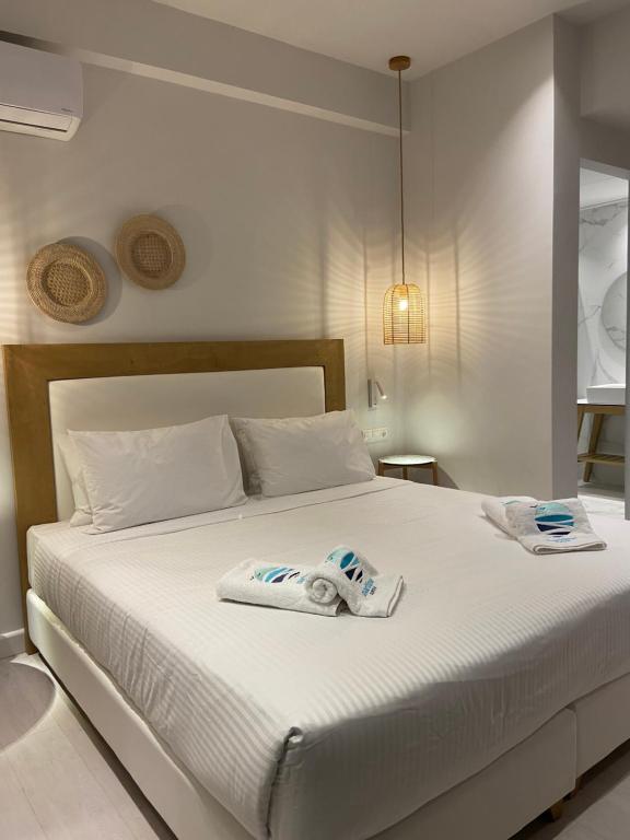 Postel nebo postele na pokoji v ubytování Maritime Suites