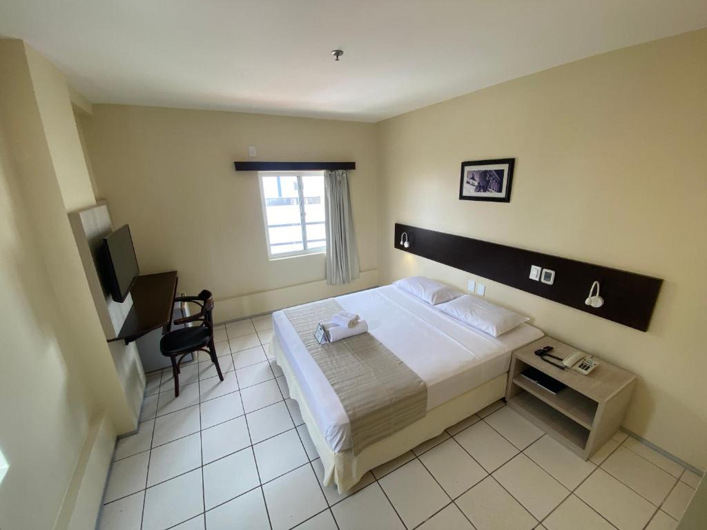 Postel nebo postele na pokoji v ubytování Hotel Premier