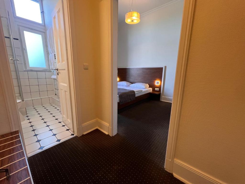 Postel nebo postele na pokoji v ubytování Hotel Excellent